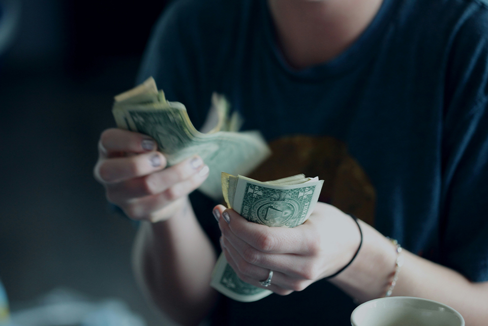 person counting money