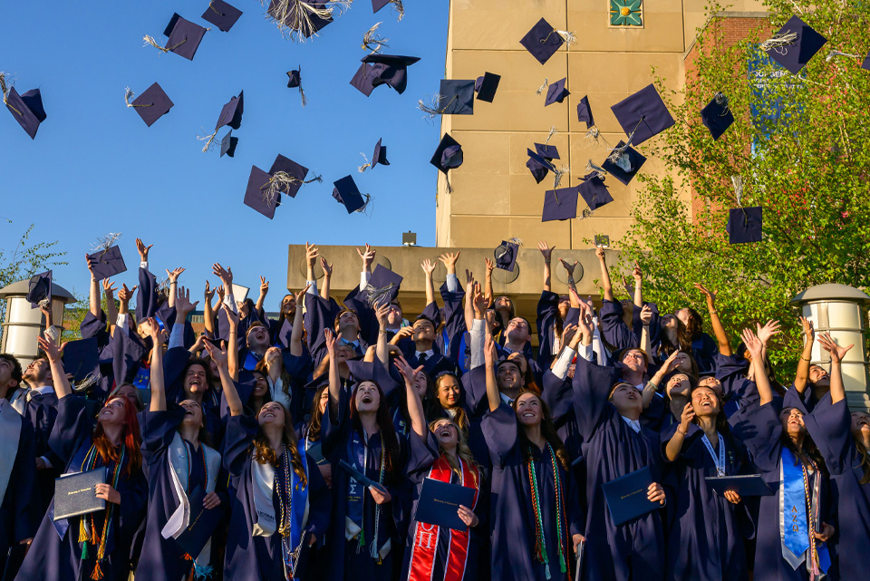 UConn graduates throw their hats into the air